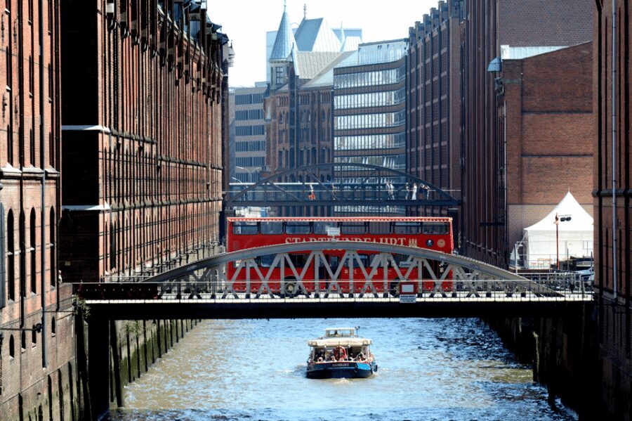 Hamburg Discovery: Bus Tour with Harbor & Alster Lake Cruise - The harbor cruise from St. Pauli Landungsbrücken: working waterfront + a humor-forward guide
